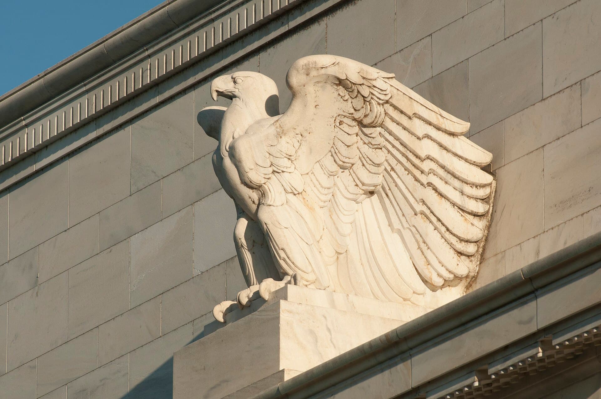 A close up of the eagle statue on the the Marriner S. Eccles building.