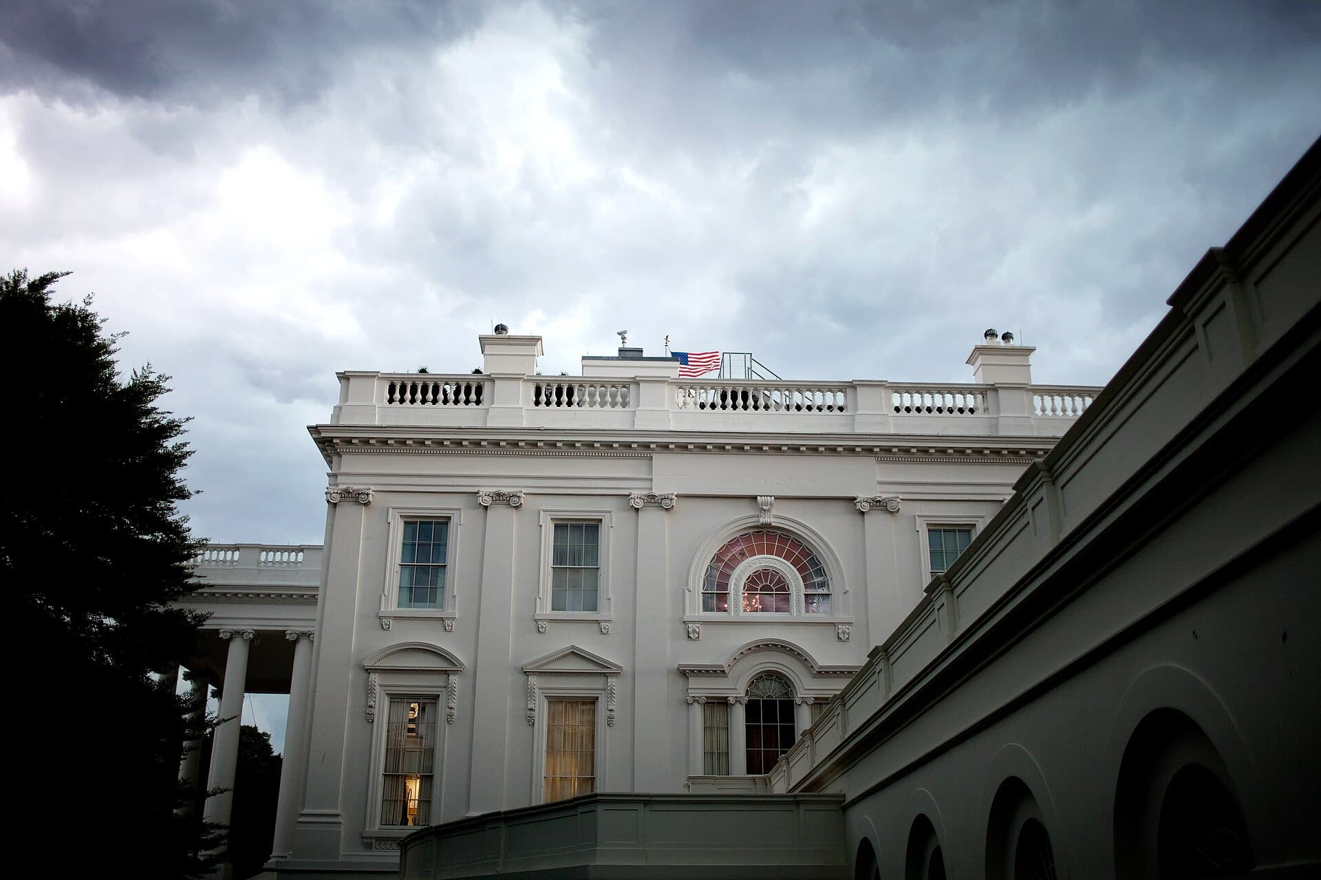 Storm clouds hang over the White House in Washington, DC, seen from the West Wing.